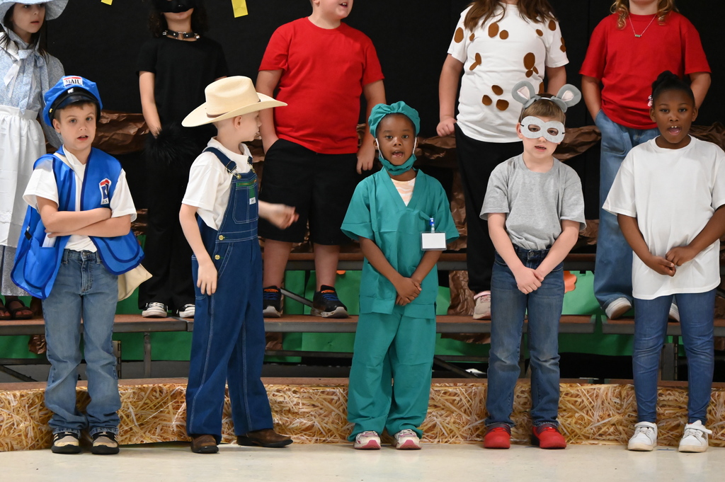2nd grade students at JKH presenting The Cheese Stands Alone.