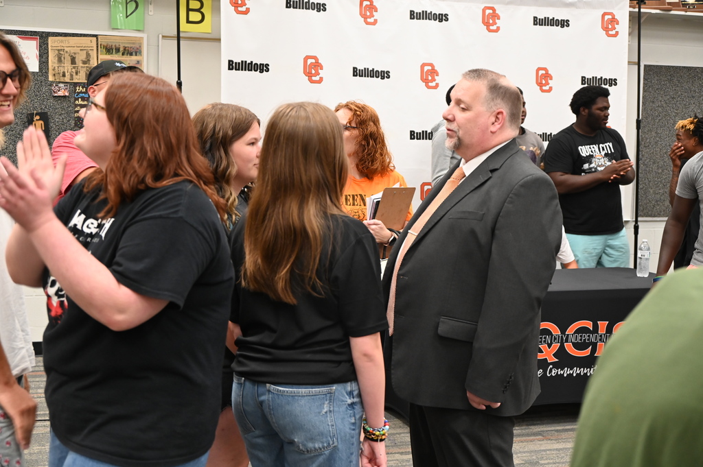 Queen City ISD Band Director Chris Moix greets students