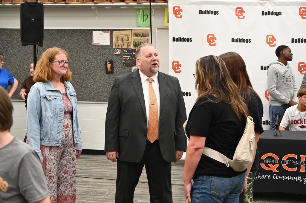 Queen City ISD Band Director Chris Moix greets students
