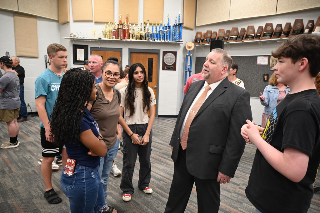 Queen City ISD Band Director Chris Moix greets students