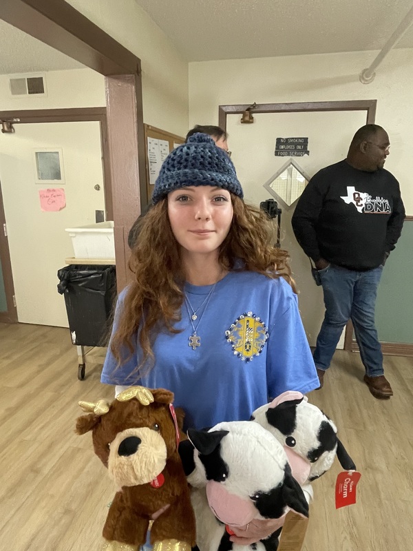 student with stuffed animals