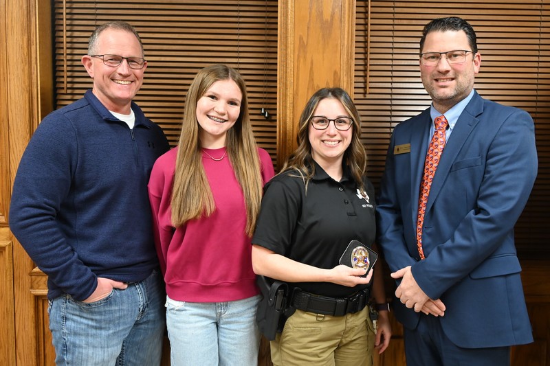 Officer Kayla Berry pictured with her husband Cory, her step-daughter Allie and Superintendent Dr. Casey Nichols