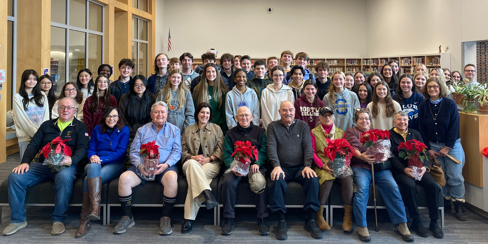 Students and veterans meet at school library.