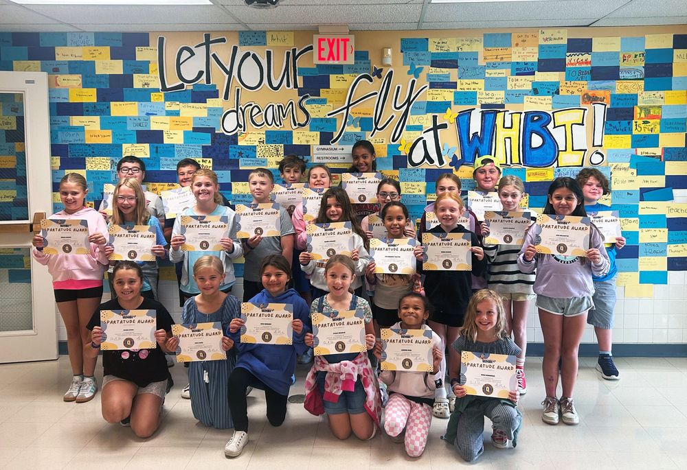 Spartatude award winners for September with certificates.