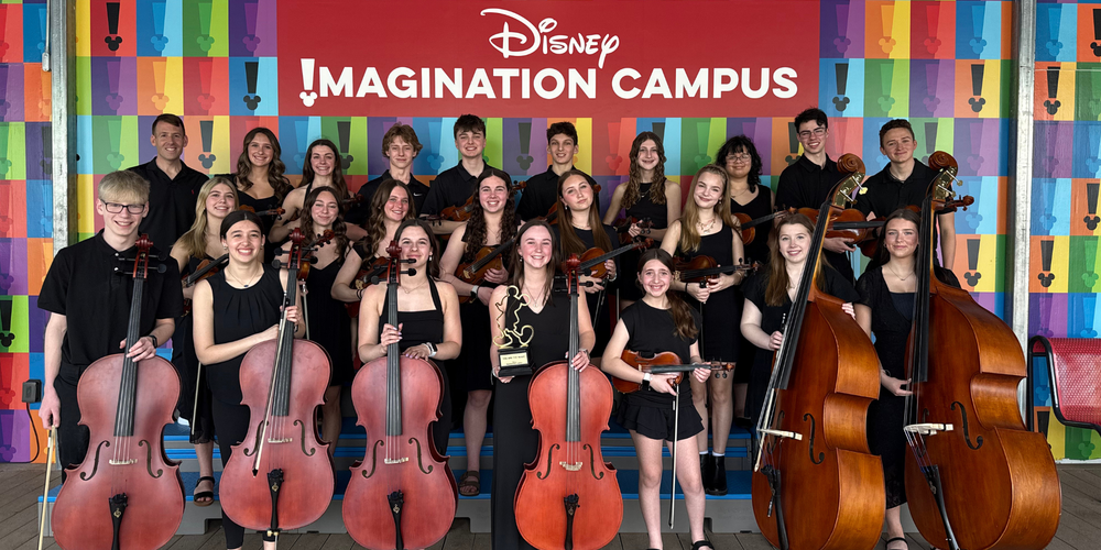 Queensbury High School Chamber Orchestra with instruments in Disney World.
