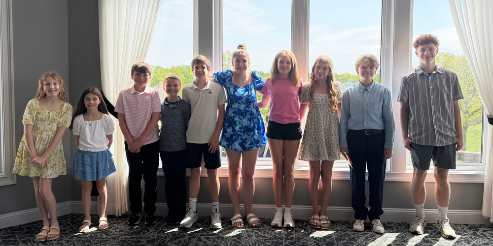 Leadership winners stand for photo at breakfast.