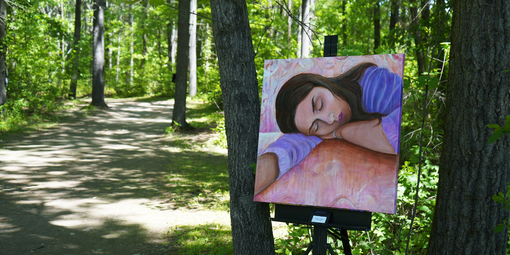 Artwork on display in the woods.