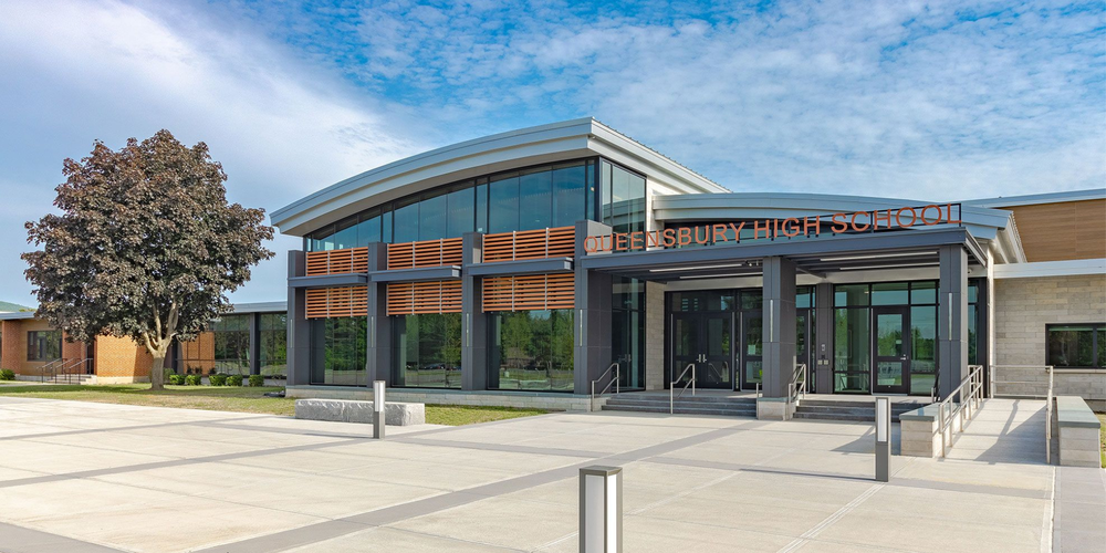 Photo of the front of Queensbury High School.