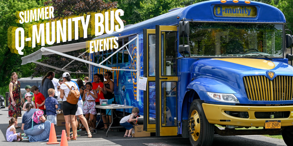 People gather around a blue bus.