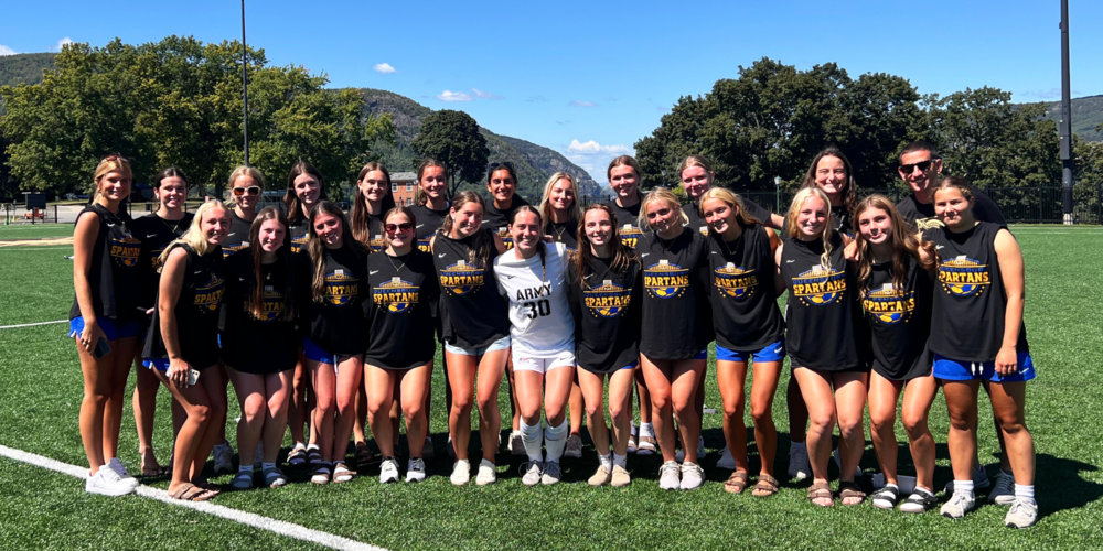 Girls soccer team visits alum.
