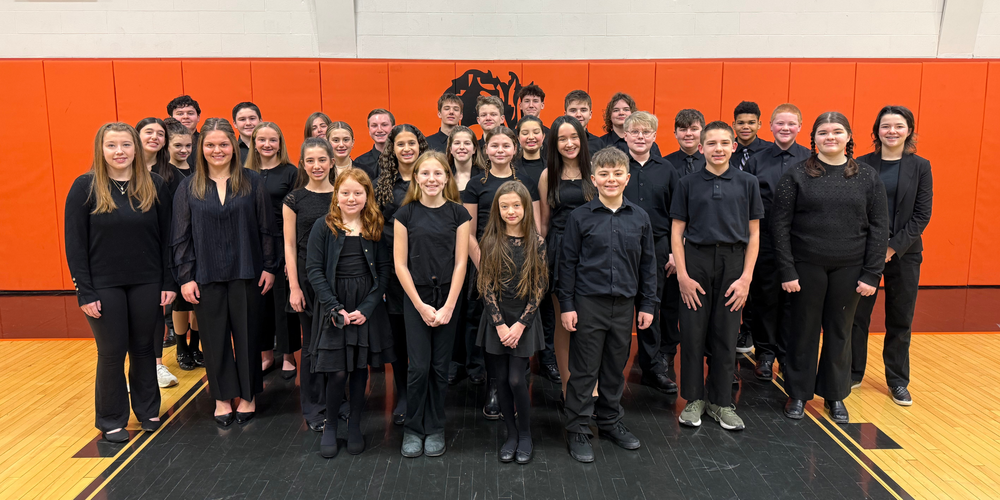 Photo of 32 Queensbury students who attended All-County Choral Festival.