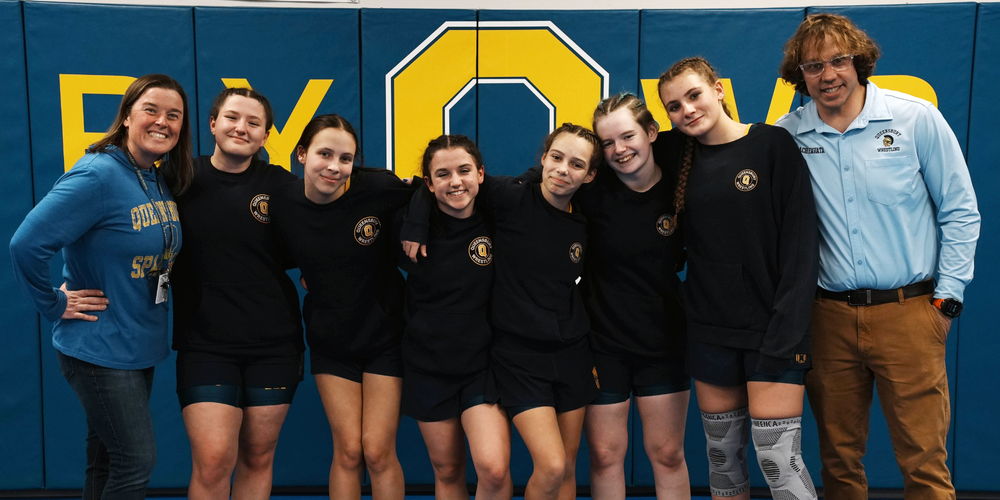 Queensbury girls wrestling team and coaches.