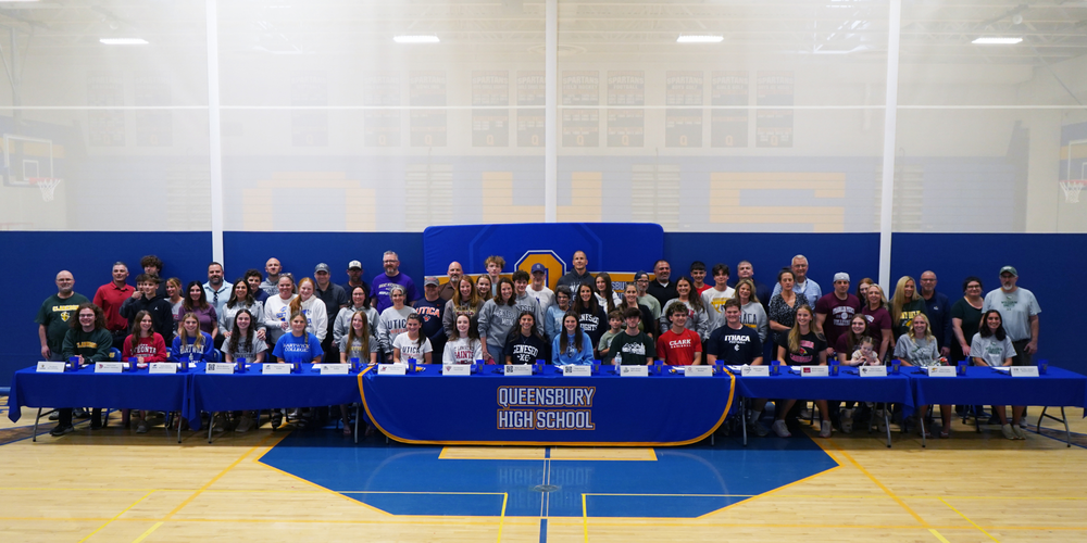 Student-athletes and their families on signing day.