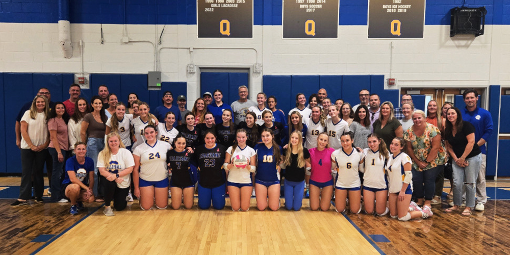 Volleyball players and their parent volunteers.