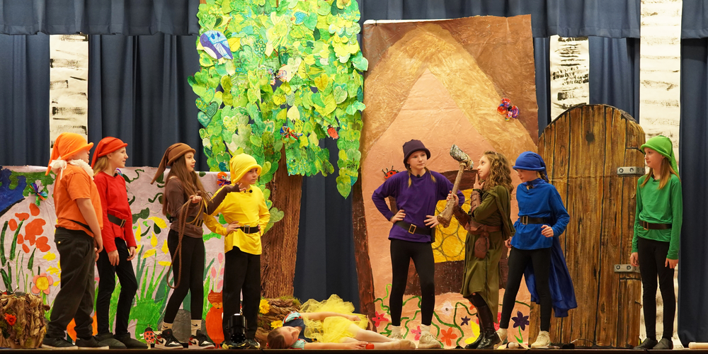 WHBI students perform on stage as 'Snow White and the Seven Endings.'