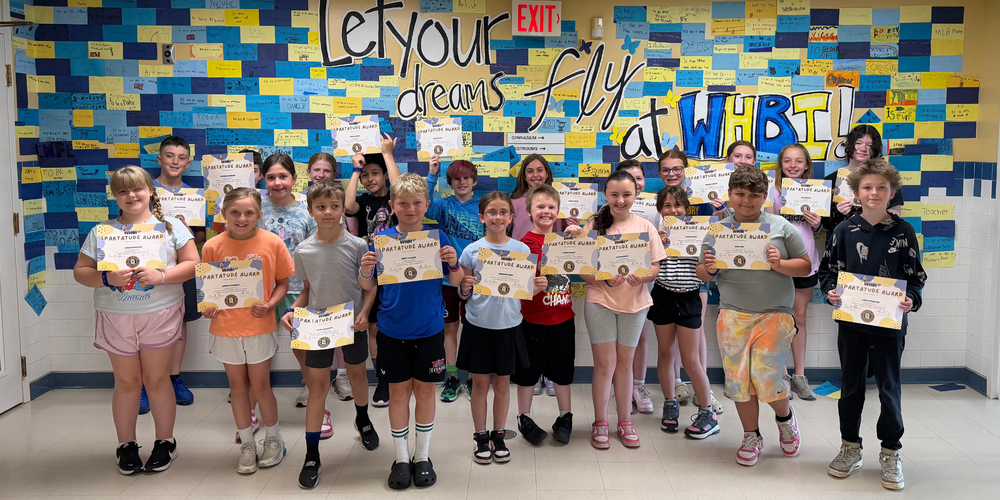 Spartatude award winners stand with certificates.
