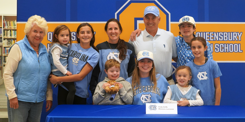Duffy family gathers for photo with Kady Duffy during Signing Day.