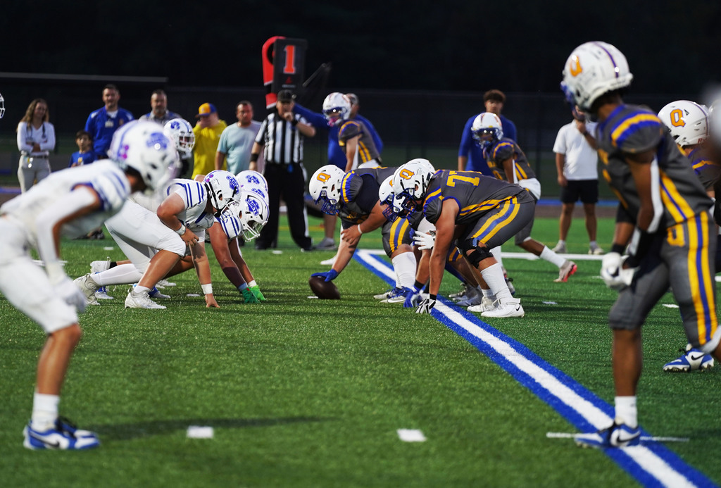 A football game on QHS turf field.