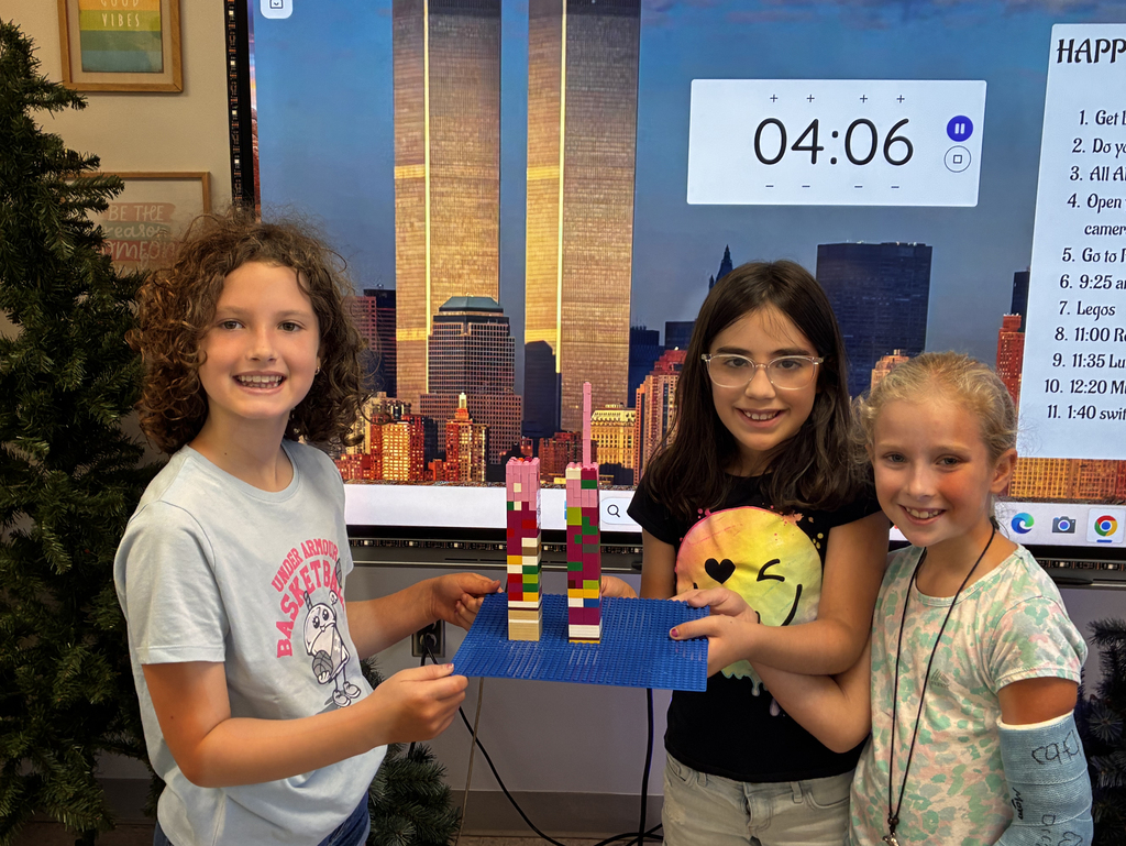 Students build Twin Towers with Lego.