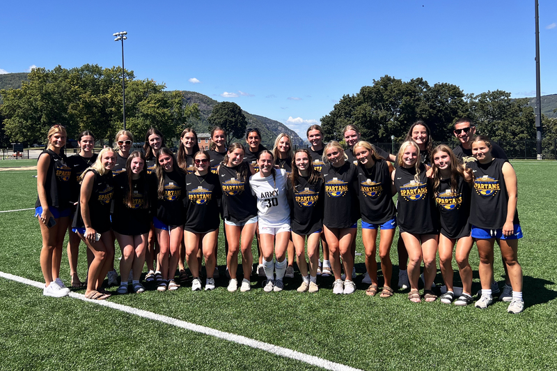 Queensbury girls varsity soccer team visits QHS grad Brigid Duffy '21, center, at West Point.