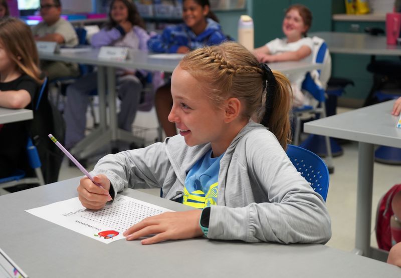 WHBI student completes a worksheet in class.