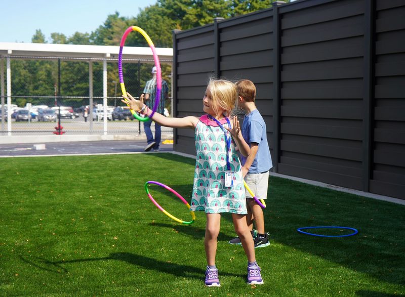 Student plays outside after lunch.
