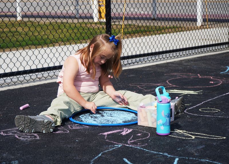 Student plays outside after lunch. 