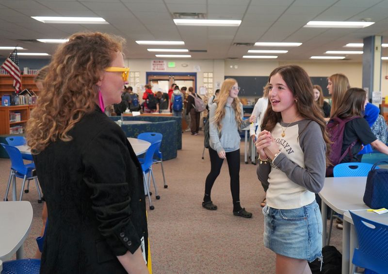 Student talks to Kate Austin at Queensbury Middle School.