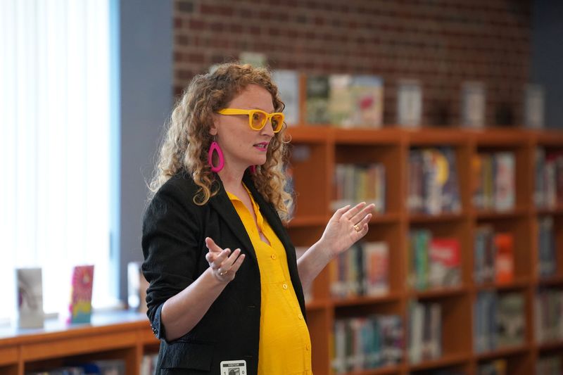 Kate Austin speaks to students at QMS.