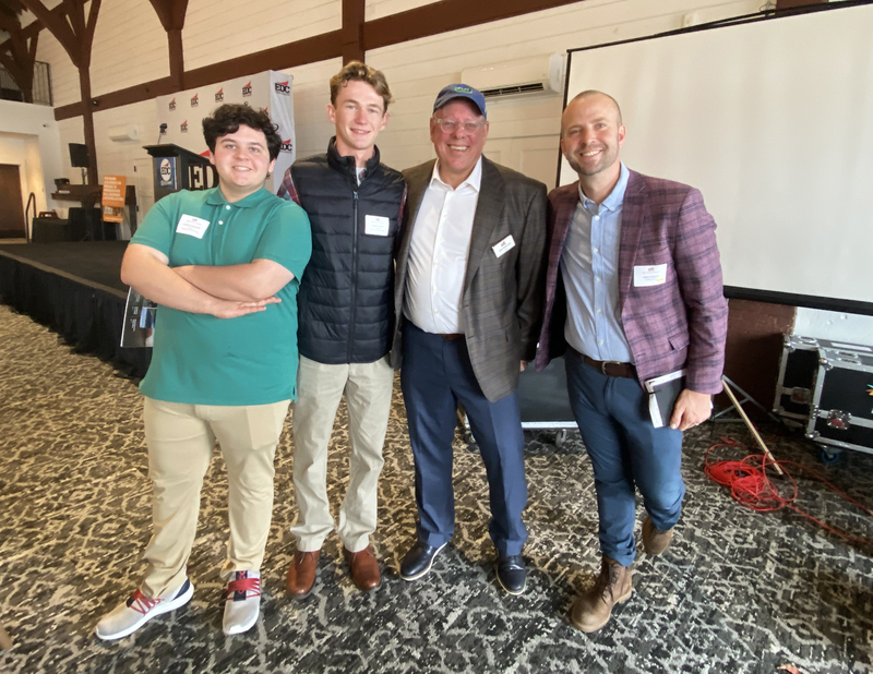 QHS students stand with  speakers at the Warren County EDC luncheon.