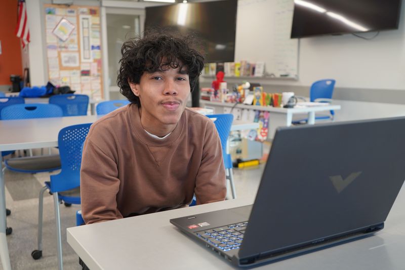 Dominique Cheese plays a video game at Queensbury High School.
