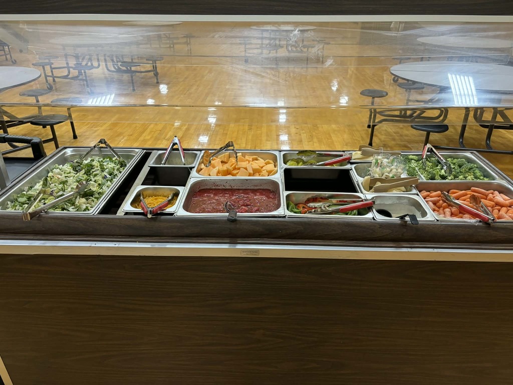 Salad bar with fruits and veggies.