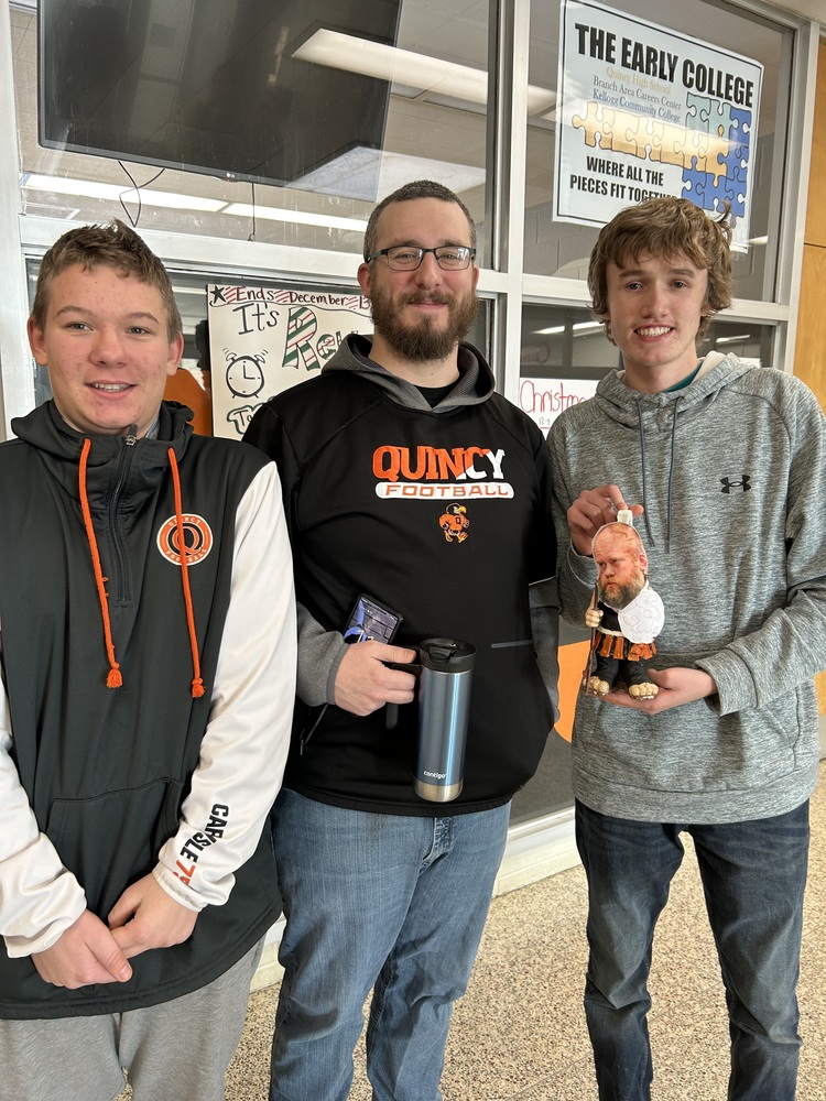 Students with Athletic Director, holding the bowling team mascot