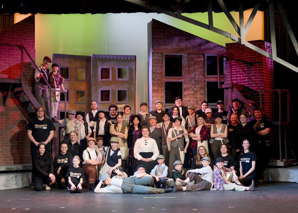 Cast of Newsies in character