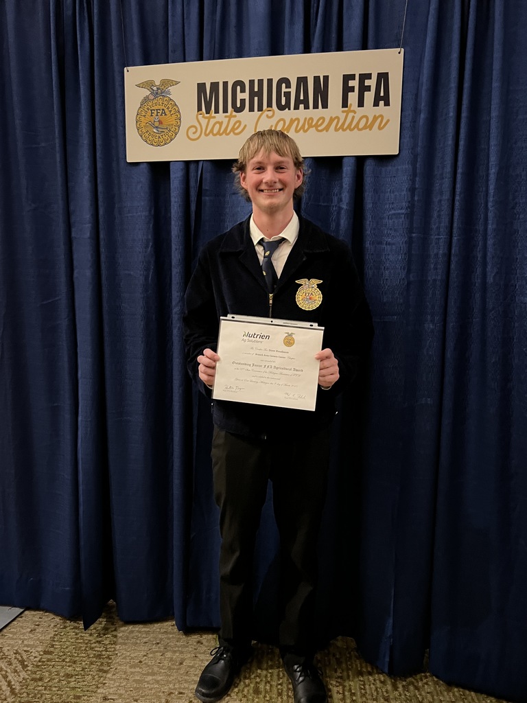 student holding certificate