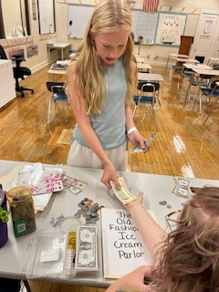 Students practicing making change