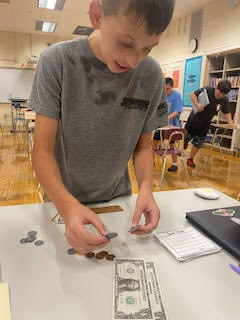 Students practicing making change