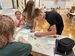 Students practicing making change