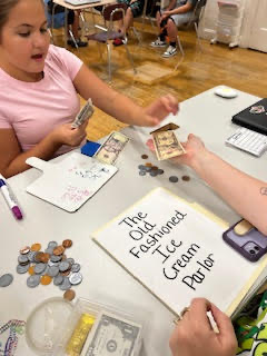 Students practicing making change