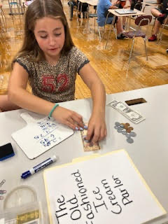 Students practicing making change