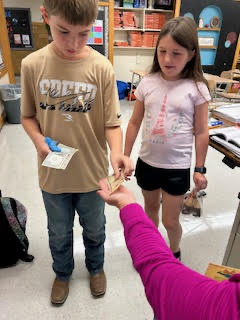 Students practicing making change