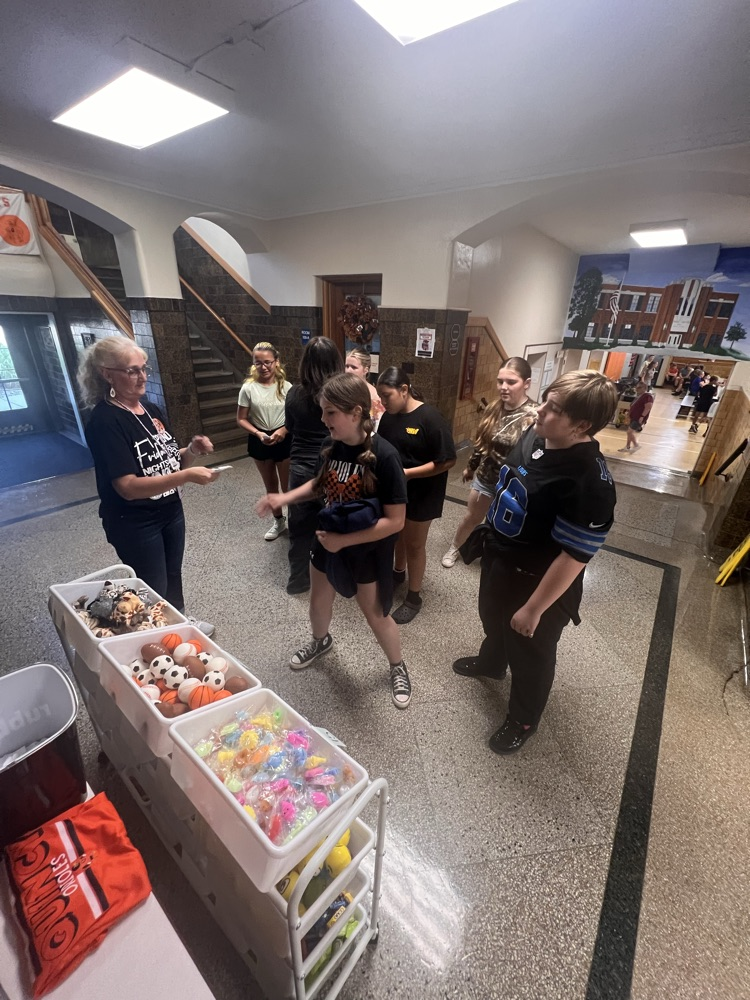 Students shopping at the QMS Pride Ticket Store