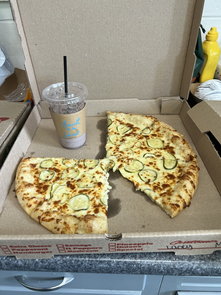 Refuge drink and pizza from Barry’s Caddy Shack
