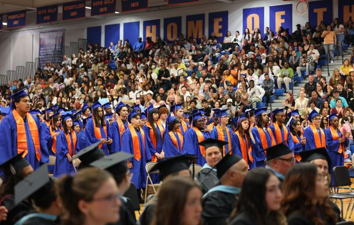 students stand for the confirmation of diplomas  
