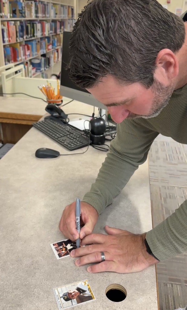 Marcus Hanel signing baseball cards