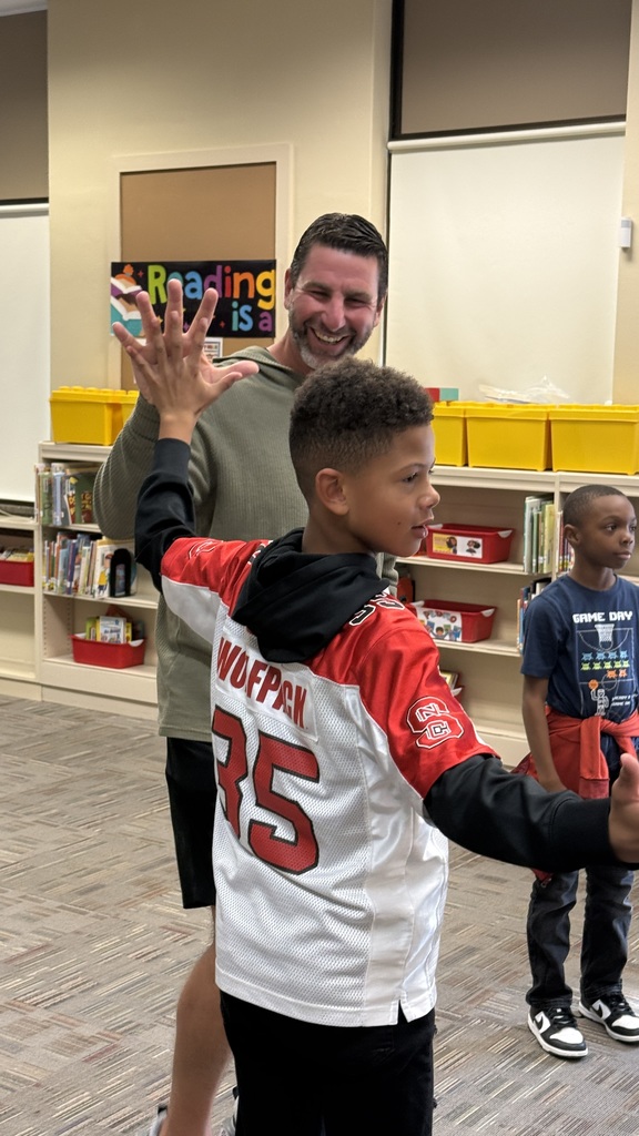 Marcus Hanel giving one student a high five