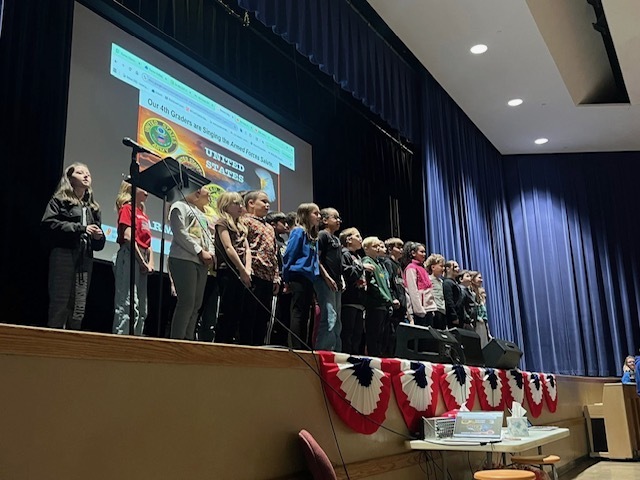 Gifford Veterans Day 2025 - 4th graders singing on stage