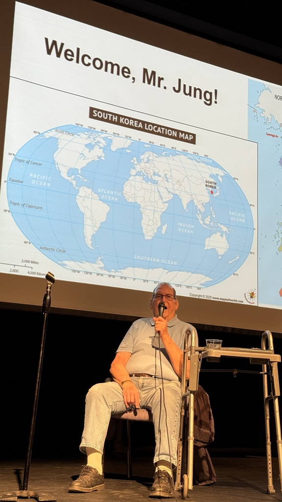 Gifford Veterans Day 2025 - Mr. Jung on stage for his visit to the school