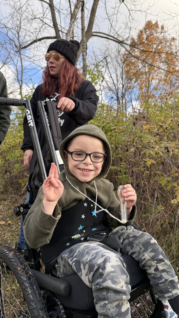 Angel Martz taking a tour of Riverbend Nature Center in a GRIT Freedom Chair.