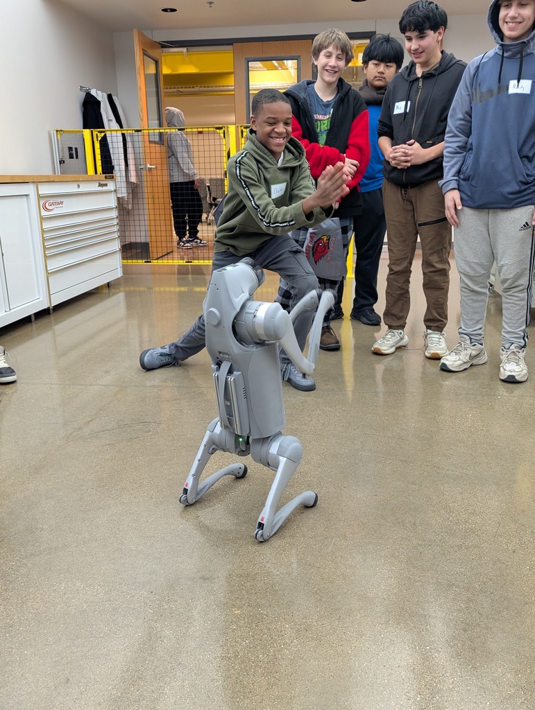 A student mimics the motions of a four-legged robot.